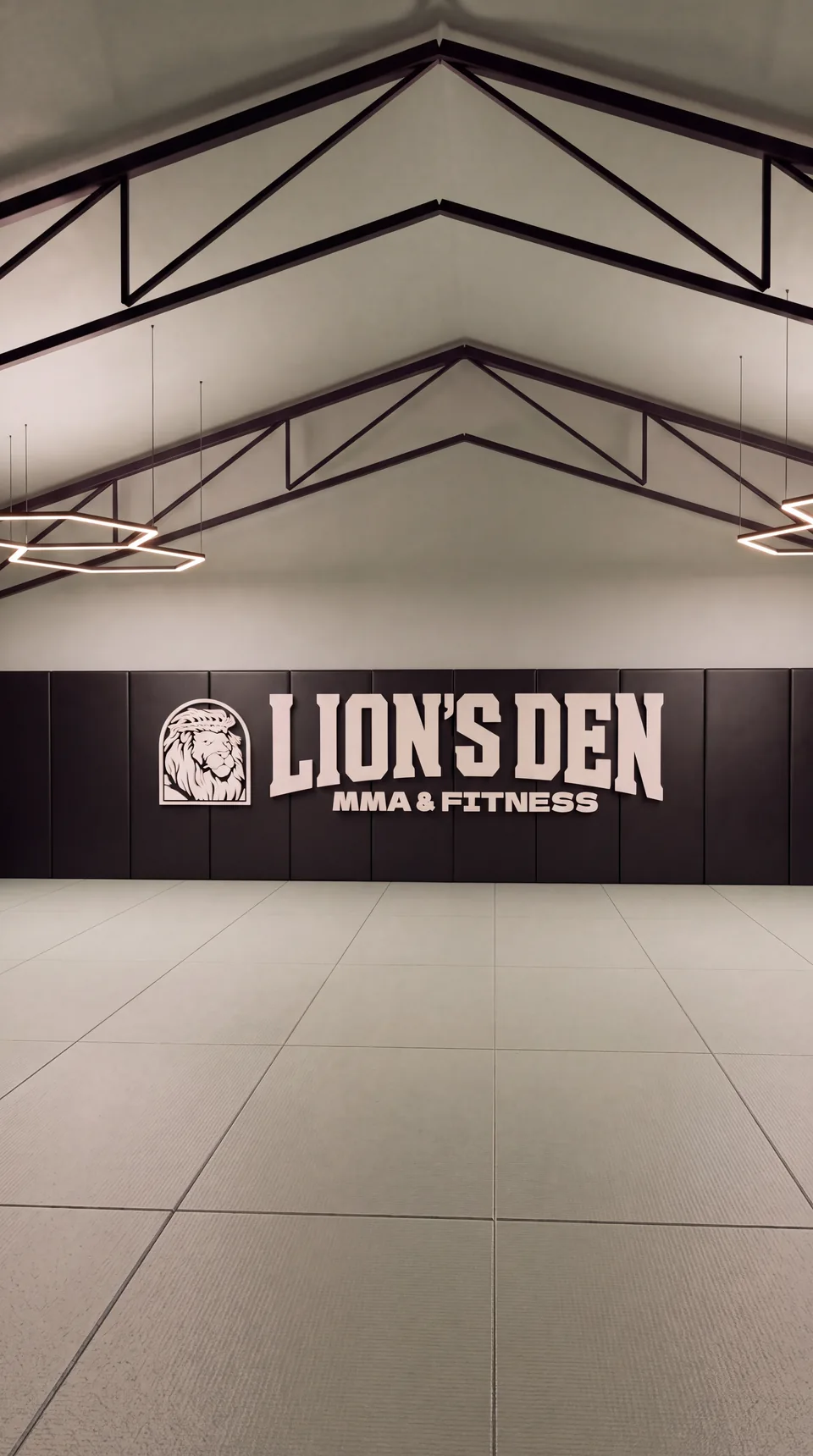Portrait concept rendering of the upstairs mat floor and Lion’s Den wall branding