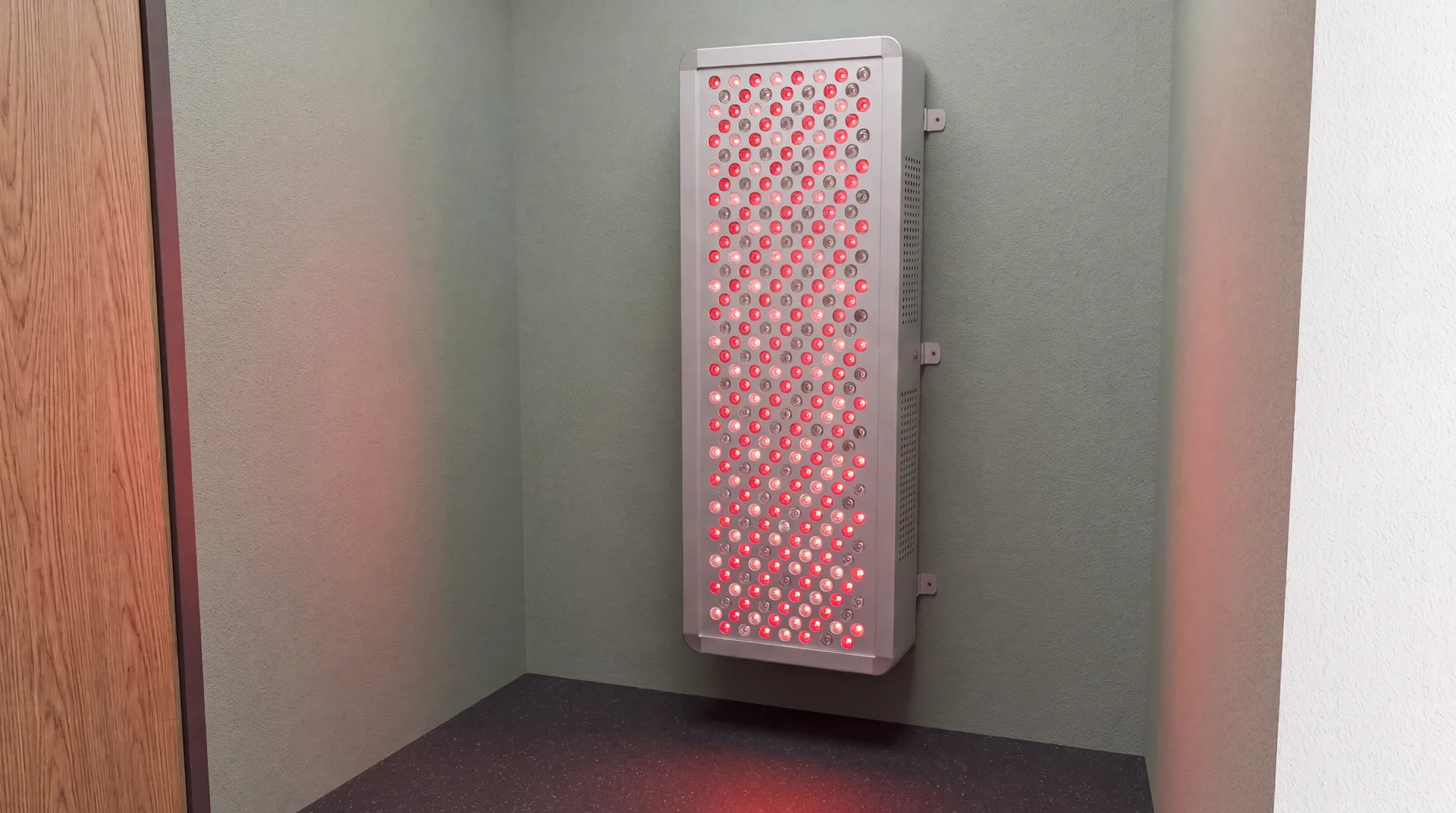 Concept rendering of a wall-mounted red-light panel in a dedicated recovery room