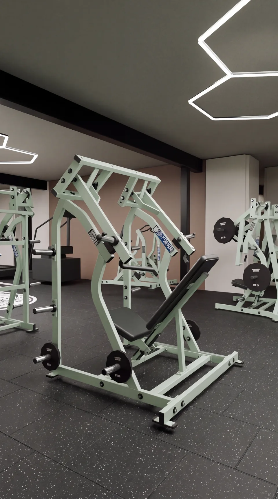 Portrait concept rendering of strength machines with sage frames and black upholstery